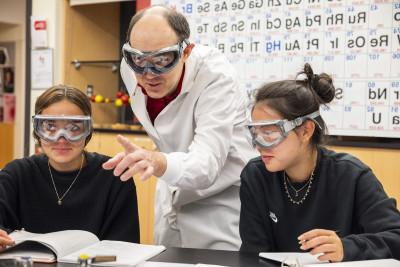Professor John Kirk teaching a class to students earning a chemistry degree.