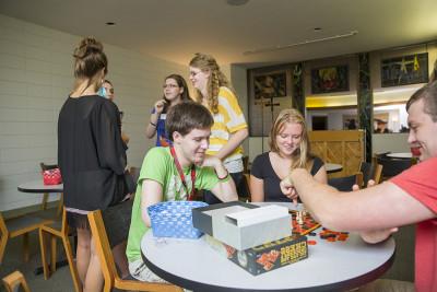 Students hang out and play games in Ehrler Hospitality Center, located in A. F. Siebert Chapel.